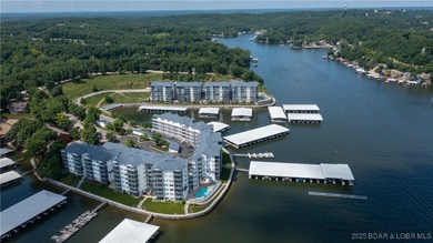 Enjoy incredible lake views from this spacious 4-bedroom, 3-bath on Tan-Tar-A Golf Club in Missouri - for sale on GolfHomes.com, golf home, golf lot
