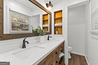 Discover this beautifully maintained brick 4-bedroom, 2.5-bath on Canongate At Flat Creek Club in Georgia - for sale on GolfHomes.com, golf home, golf lot