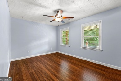 Discover this beautifully maintained brick 4-bedroom, 2.5-bath on Canongate At Flat Creek Club in Georgia - for sale on GolfHomes.com, golf home, golf lot