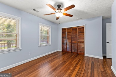 Discover this beautifully maintained brick 4-bedroom, 2.5-bath on Canongate At Flat Creek Club in Georgia - for sale on GolfHomes.com, golf home, golf lot