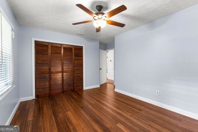 Discover this beautifully maintained brick 4-bedroom, 2.5-bath on Canongate At Flat Creek Club in Georgia - for sale on GolfHomes.com, golf home, golf lot
