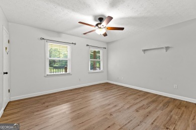 Discover this beautifully maintained brick 4-bedroom, 2.5-bath on Canongate At Flat Creek Club in Georgia - for sale on GolfHomes.com, golf home, golf lot