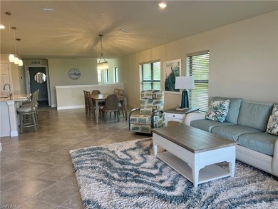 TURNKEY! WATER + GOLF VIEWS! END UNIT CONDO IN DEL WEBB NAPLES on Panther Run Golf Club in Florida - for sale on GolfHomes.com, golf home, golf lot