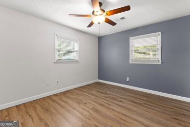 Discover this beautifully maintained brick 4-bedroom, 2.5-bath on Canongate At Flat Creek Club in Georgia - for sale on GolfHomes.com, golf home, golf lot