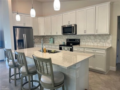 TURNKEY! WATER + GOLF VIEWS! END UNIT CONDO IN DEL WEBB NAPLES on Panther Run Golf Club in Florida - for sale on GolfHomes.com, golf home, golf lot