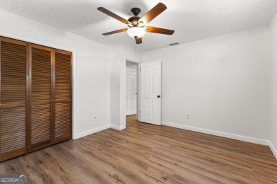 Discover this beautifully maintained brick 4-bedroom, 2.5-bath on Canongate At Flat Creek Club in Georgia - for sale on GolfHomes.com, golf home, golf lot