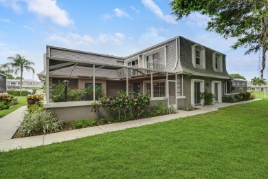 Fall in love with this beautiful corner townhome surrounded by on BallenIsles Golf and Country Club in Florida - for sale on GolfHomes.com, golf home, golf lot