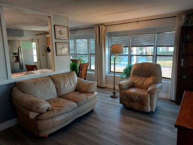 The Lot Rent for this home is $1,047.00/monthly. A cozy on Lake Fairways Country Club in Florida - for sale on GolfHomes.com, golf home, golf lot