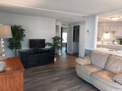 The Lot Rent for this home is $1,047.00/monthly. A cozy on Lake Fairways Country Club in Florida - for sale on GolfHomes.com, golf home, golf lot