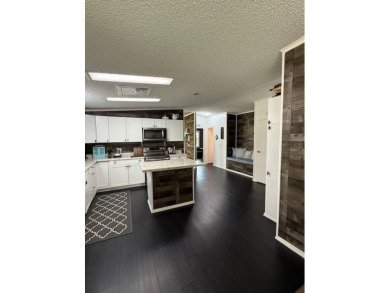 Prepare to be captivated by this **completely reimagined gem** on Hamptons Golf Club in Florida - for sale on GolfHomes.com, golf home, golf lot