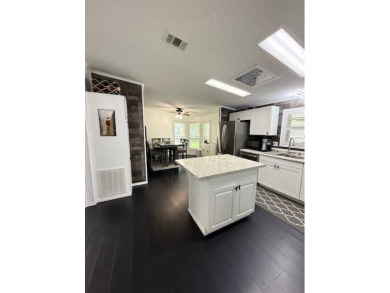 Prepare to be captivated by this **completely reimagined gem** on Hamptons Golf Club in Florida - for sale on GolfHomes.com, golf home, golf lot