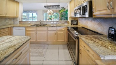 Welcome to 786 Regency Reserve Circle #1404, an elegant coach on Vineyards Golf and Country Club in Florida - for sale on GolfHomes.com, golf home, golf lot
