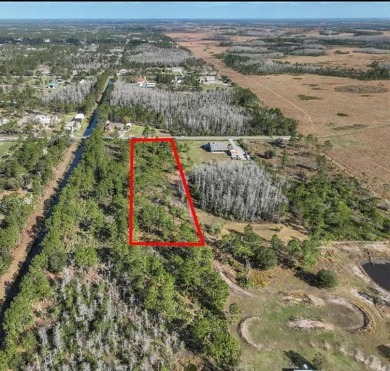 RARE FIND! Escape the ordinary and DISCOVER 2.17 ACRES OF PRIME on Wedgefield Golf Club in Florida - for sale on GolfHomes.com, golf home, golf lot