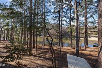 Enjoy lakefront living with peaceful water views and on Carolina Trace Country Club in North Carolina - for sale on GolfHomes.com, golf home, golf lot