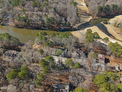Enjoy lakefront living with peaceful water views and on Carolina Trace Country Club in North Carolina - for sale on GolfHomes.com, golf home, golf lot