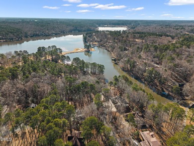 Enjoy lakefront living with peaceful water views and on Carolina Trace Country Club in North Carolina - for sale on GolfHomes.com, golf home, golf lot