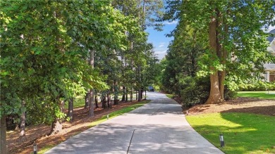 Privately tucked behind a long, tree-lined driveway and greeted on Chateau Elan Golf Club  in Georgia - for sale on GolfHomes.com, golf home, golf lot