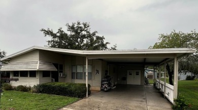 This delightful 2-bedroom, 2-bathroom retreat boasts a generous on Lake Henry Golf Club in Florida - for sale on GolfHomes.com, golf home, golf lot