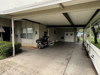 This delightful 2-bedroom, 2-bathroom retreat boasts a generous on Lake Henry Golf Club in Florida - for sale on GolfHomes.com, golf home, golf lot