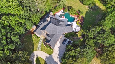 Privately tucked behind a long, tree-lined driveway and greeted on Chateau Elan Golf Club  in Georgia - for sale on GolfHomes.com, golf home, golf lot