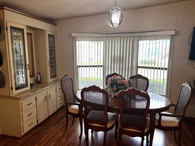 This delightful 2-bedroom, 2-bathroom retreat boasts a generous on Lake Henry Golf Club in Florida - for sale on GolfHomes.com, golf home, golf lot