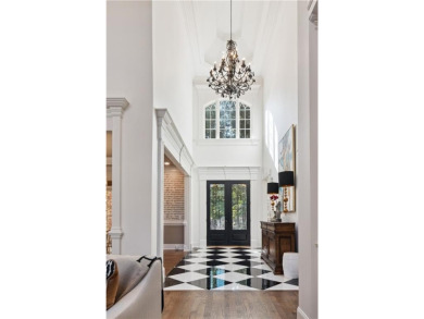 Privately tucked behind a long, tree-lined driveway and greeted on Chateau Elan Golf Club  in Georgia - for sale on GolfHomes.com, golf home, golf lot