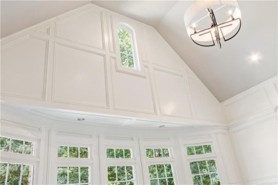 Privately tucked behind a long, tree-lined driveway and greeted on Chateau Elan Golf Club  in Georgia - for sale on GolfHomes.com, golf home, golf lot