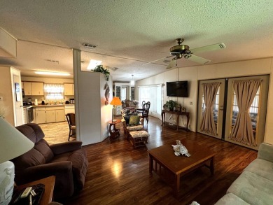 This delightful 2-bedroom, 2-bathroom retreat boasts a generous on Lake Henry Golf Club in Florida - for sale on GolfHomes.com, golf home, golf lot