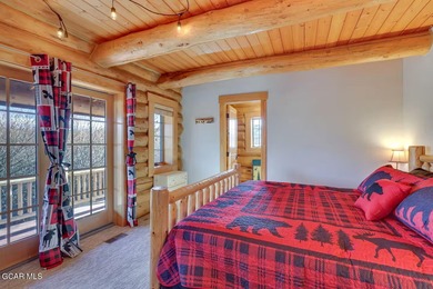 Tucked in the heart of Granby, this enchanting log cabin on Grand Elk Ranch and Club in Colorado - for sale on GolfHomes.com, golf home, golf lot