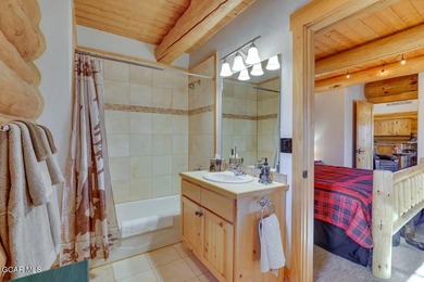 Tucked in the heart of Granby, this enchanting log cabin on Grand Elk Ranch and Club in Colorado - for sale on GolfHomes.com, golf home, golf lot