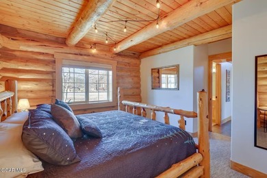 Tucked in the heart of Granby, this enchanting log cabin on Grand Elk Ranch and Club in Colorado - for sale on GolfHomes.com, golf home, golf lot