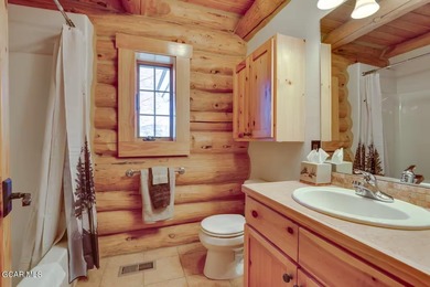 Tucked in the heart of Granby, this enchanting log cabin on Grand Elk Ranch and Club in Colorado - for sale on GolfHomes.com, golf home, golf lot