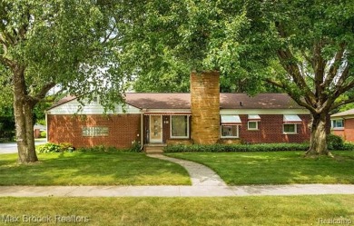 Meticulously maintained brick Ranch on a double lot in South on Western Golf and Country Club in Michigan - for sale on GolfHomes.com, golf home, golf lot