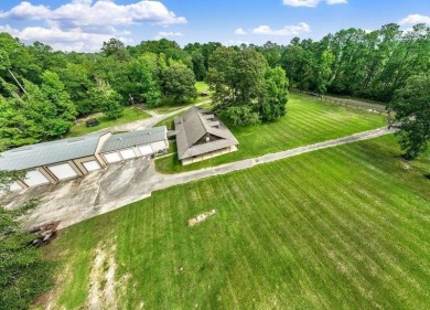 Nestled on 21 picturesque acres, this 4-bedroom, 3-bath rustic on Rayburn Country Club in Texas - for sale on GolfHomes.com, golf home, golf lot