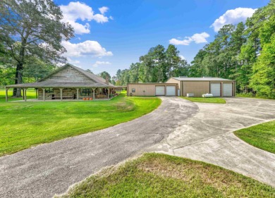 Nestled on 21 picturesque acres, this 4-bedroom, 3-bath rustic on Rayburn Country Club in Texas - for sale on GolfHomes.com, golf home, golf lot