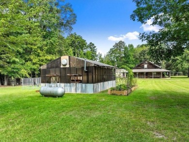 Nestled on 21 picturesque acres, this 4-bedroom, 3-bath rustic on Rayburn Country Club in Texas - for sale on GolfHomes.com, golf home, golf lot