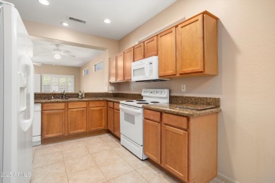 Resort-style living in one of Sun City Grand's most sought-after on Sun City Grand Golf Couse and Club in Arizona - for sale on GolfHomes.com, golf home, golf lot