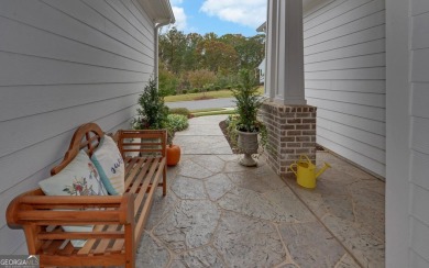 DUNWOODY Model  Covered front porch with brick elevation.  This on Chateau Elan Golf Club  in Georgia - for sale on GolfHomes.com, golf home, golf lot