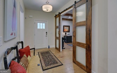 DUNWOODY Model  Covered front porch with brick elevation.  This on Chateau Elan Golf Club  in Georgia - for sale on GolfHomes.com, golf home, golf lot