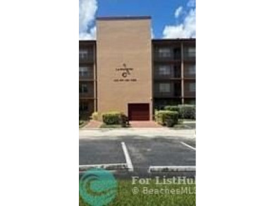 1st floor unit.  Larger one bedroom.  Vinyl flooring throughout on  in Florida - for sale on GolfHomes.com, golf home, golf lot
