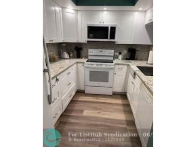 1st floor unit.  Larger one bedroom.  Vinyl flooring throughout on  in Florida - for sale on GolfHomes.com, golf home, golf lot