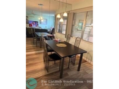 1st floor unit.  Larger one bedroom.  Vinyl flooring throughout on  in Florida - for sale on GolfHomes.com, golf home, golf lot
