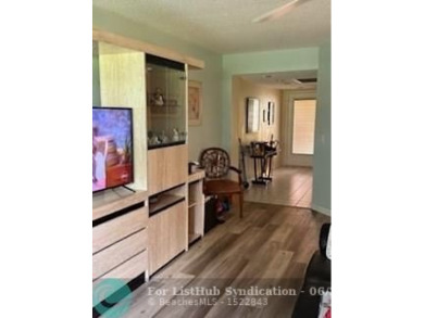 1st floor unit.  Larger one bedroom.  Vinyl flooring throughout on  in Florida - for sale on GolfHomes.com, golf home, golf lot