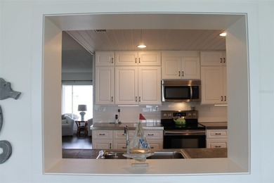 Welcome to this stunning and updated Ebbtide model home on Mainlands Golf Club in Florida - for sale on GolfHomes.com, golf home, golf lot