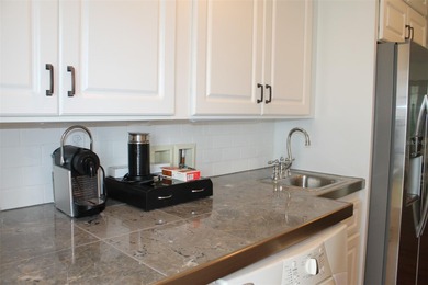 Welcome to this stunning and updated Ebbtide model home on Mainlands Golf Club in Florida - for sale on GolfHomes.com, golf home, golf lot