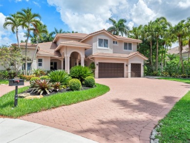 Discover a redefined standard of style and sophistication in on Weston Hills Country Club in Florida - for sale on GolfHomes.com, golf home, golf lot