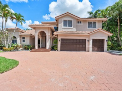 Discover a redefined standard of style and sophistication in on Weston Hills Country Club in Florida - for sale on GolfHomes.com, golf home, golf lot