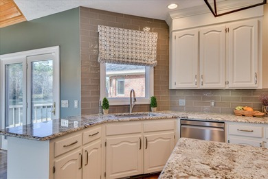 Updated waterfront home on a half-acre lot in Woodside featuring on Woodside Plantation Country Club in South Carolina - for sale on GolfHomes.com, golf home, golf lot