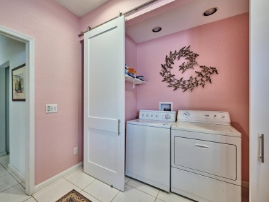 Welcome to this beautifully maintained 3-bedroom, 2.5-bathroom on Wycliffe Golf and Country Club in Florida - for sale on GolfHomes.com, golf home, golf lot