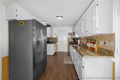 This beautifully maintained 4-bedroom, 31/2-bathroom home in the on Baywood Golf Club in North Carolina - for sale on GolfHomes.com, golf home, golf lot